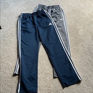 Two pair of kids Adidas track pants, both size large
